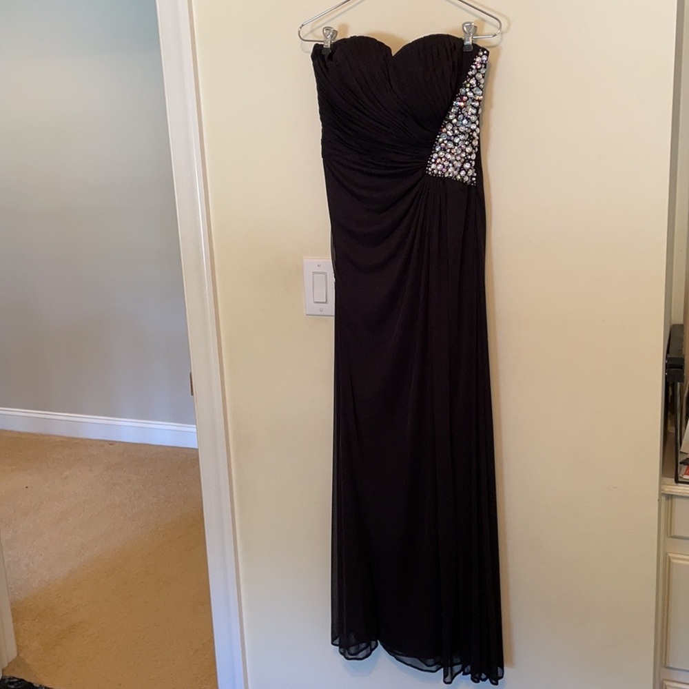 Black evening gown with beaded detail.